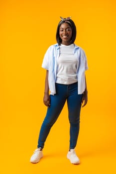 Full length portrait of a beautiful young african woman posing in photostudio close up