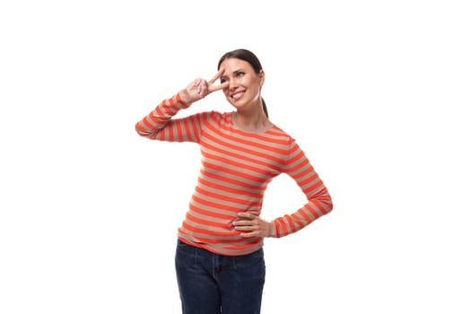 young smiling adult woman dressed in orange striped blouse isolated on white background.