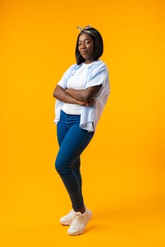 Full length portrait of a beautiful young african woman posing in photostudio close up