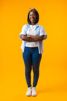 Full length portrait of a beautiful young african woman posing in photostudio close up