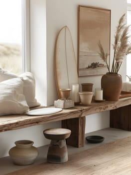 A living room with hardwood flooring featuring a wooden bench, vases, candles, and a surfboard on the wall, creating a stylish interior design