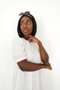 Beautiful young african woman posing over white background, portrait