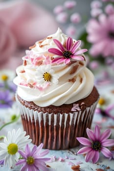 A delectable chocolate cupcake adorned with white frosting and delicate pink flowers on top, beautifully made using cake decorating techniques