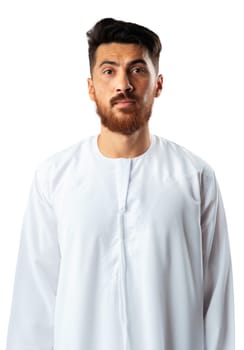 Smiling arab man while standing in an isolated white studio close up