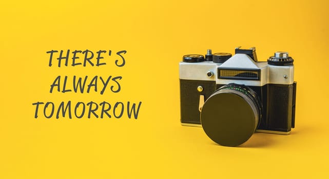 A camera is on a yellow background with the words There's always tomorrow written below it