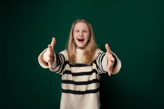 A girl wearing a striped sweater is shown making a hand gesture, her facial expression hinting at determination. Her hand is raised with fingers positioned in a specific way.