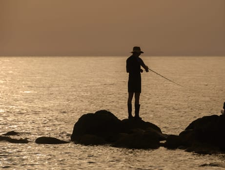 Gazeveren Cyprus -05.18.2024 fisherman catches fish on the seashoreс 1