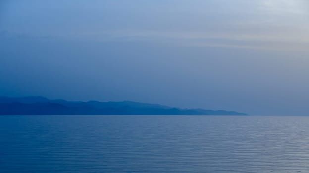 sea ​​view and burning in cyprus after sunset blue hour 1