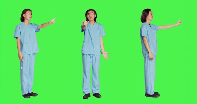Medical specialist doing no sign on camera, presenting negative reaction and his disapproval. Asian healthcare nurse being displeased and disappointed about something, disagreeing.