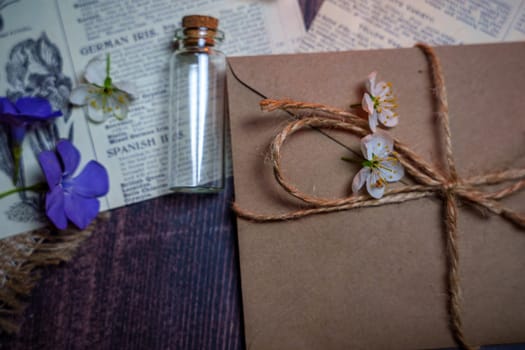 Mystical still life in vintage style with empty flasks, letters and newspaper clippings. High quality photo