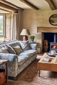 Cottage interior with modern design and antique furniture, home decor, sitting room and living room, sofa and fireplace in English country house and countryside style interiors