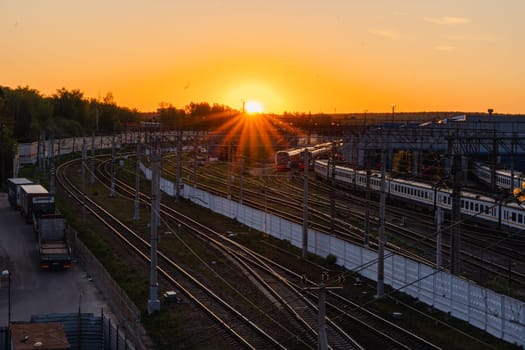 A red sunset over the railway tracks. Urbanism and infrastructure. High quality photo