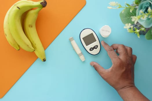 top vie of diabetic measurement tools and banana on a table ,