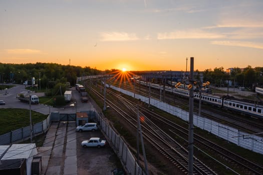 A red sunset over the railway tracks. Urbanism and infrastructure. High quality photo