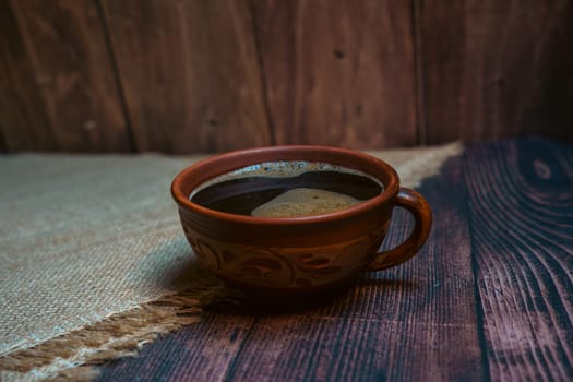 A mug of hot coffee on the table. High quality photo