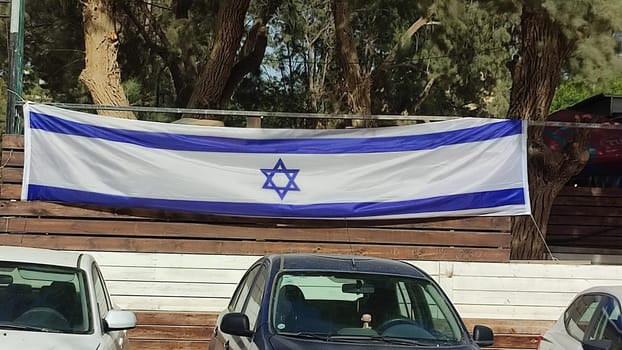 May 22, 2024 Beer Sheva Negev Israel, Israeli flag in the fence view from the street. High quality photo