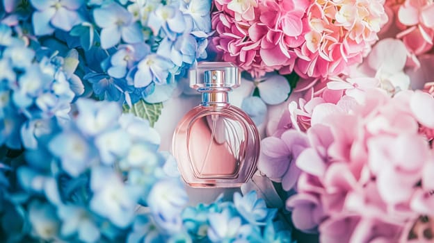 Perfume bottle with beautiful flowers. Floral background. Beauty concept. Flat lay, top view.