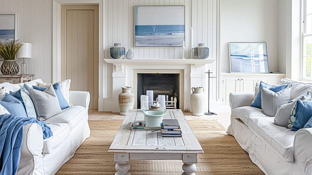 Interior of a living room with white walls, sofa and cushions. Sitting room in coastal cottage with sea view. Luxury lounge room