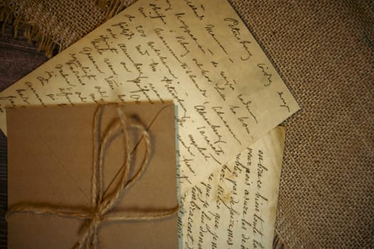 An antique envelope and a letter on the table. High quality photo