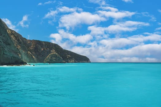 Crystal clear turquoise sea next to a rocky formation in Lefkada Ionian Island Geece.