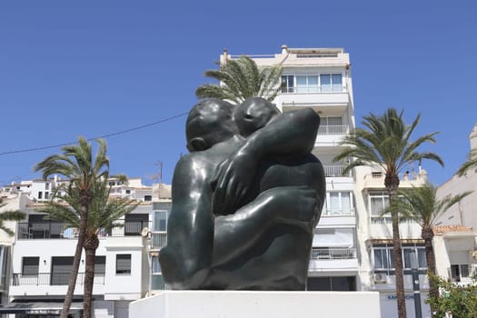 Altea's urban landscape with abstract sculpture, palm trees, playground