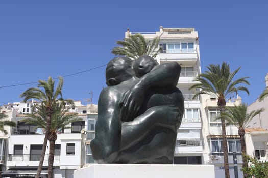 Altea's urban landscape with abstract sculpture, palm trees, playground