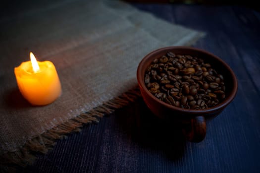 Coffee beans in a clay mug. High quality photo