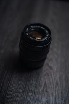 Classic Helios 44-7 lens on a wooden table . High quality photo