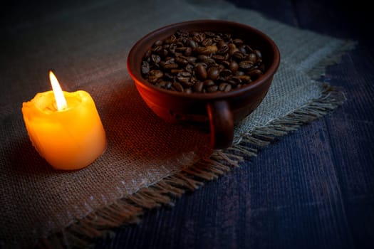 Coffee beans in a clay mug. High quality photo