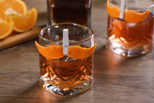 The Sharpie Mustache is a cocktail that's easy to make with equal parts rye whiskey, gin, sweet vermouth and a few drops of bitters, and garnished with a mustache-shaped orange zest