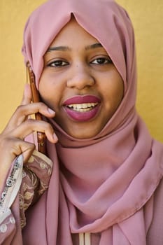 A close-up portrait captures the engagement of a Middle Eastern teenage Muslim girl in her digital world, as she uses a smartphone with focused attention