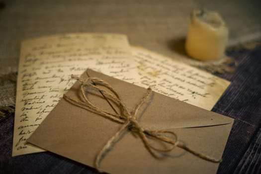 An antique envelope and a letter on the table. High quality photo