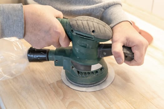 Work with a grinder on wood. Work tool. High quality photo