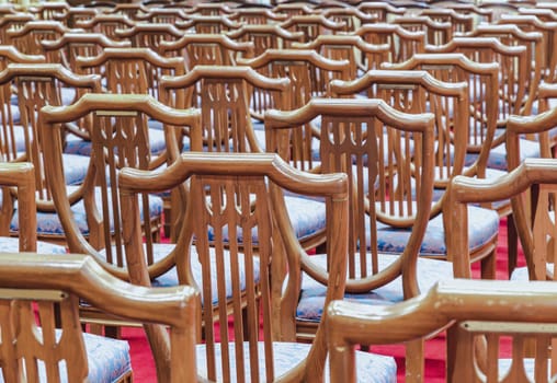 Bangkok, Thailand - May 22, 2024 - Chairs set for sitting within Samphanthawong Saram Worawihan temple. Copy space, Selective focus.