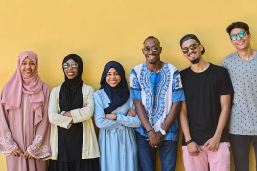 A diverse group of African-American and Middle Eastern teenagers stand confidently in front of a vibrant yellow wall, showcasing unity and urban style