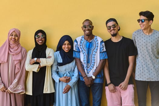 A diverse group of African-American and Middle Eastern teenagers stand confidently in front of a vibrant yellow wall, showcasing unity and urban style