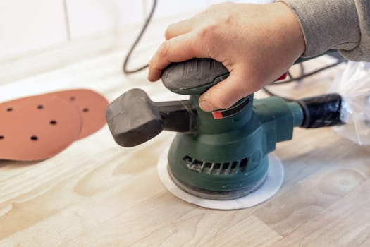 Work with a grinder on wood. Work tool. High quality photo