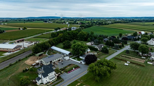 An Aerial View of Rural Community with Farmland and Houses