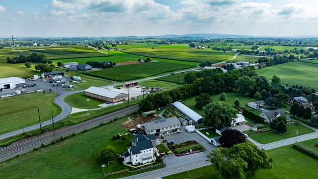 An Aerial View of Rural Community with Farms, Homes, and Industrial Area