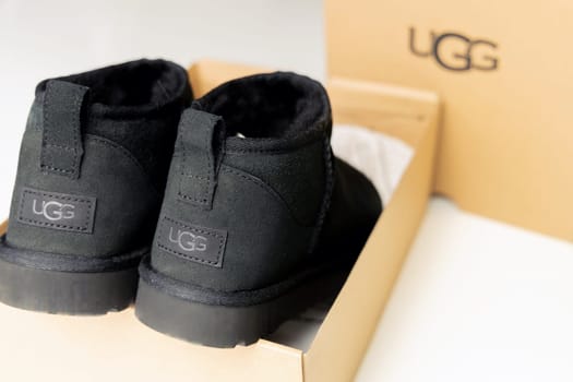 Fashionable modern short UGG boots made of sheep fur for the winter. Denmark - Oktober 25, 2023