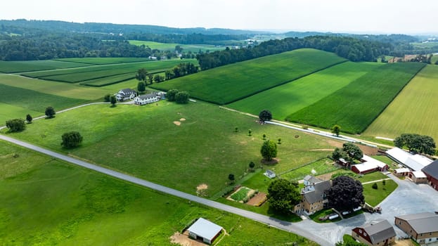 An Aerial View of Farmlands and Rural Homesteads