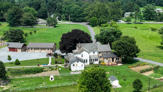 Paradise, Pennsylvania, USA, July 18. 2023 - An Aerial View of a Farmhouse with Surrounding Greenery