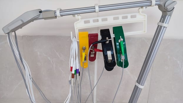 multi-colored clothespins on a medical device in a clinic, objects. High quality photo