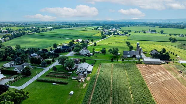 An Aerial View of Rural Community with Farmland and Homes