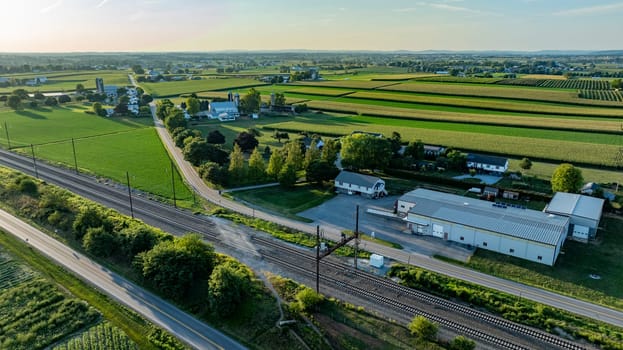 An Aerial View of Industrial and Farmland Area at Sunset