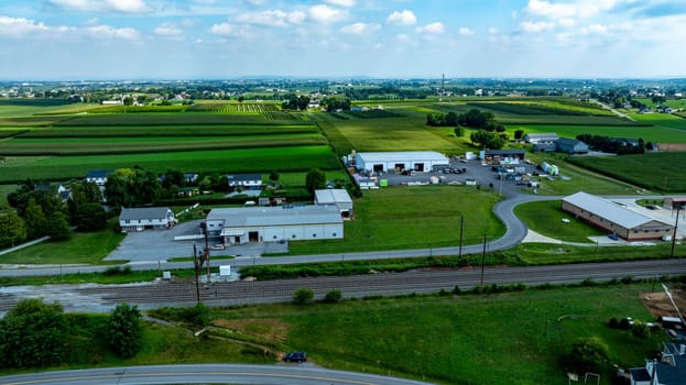 An Aerial View of Rural Community with Farms, Homes, and Industrial Area