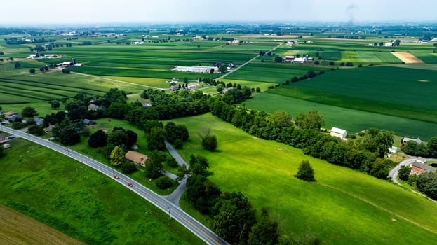 An Aerial View of Rural Road and Farmlands in Countryside