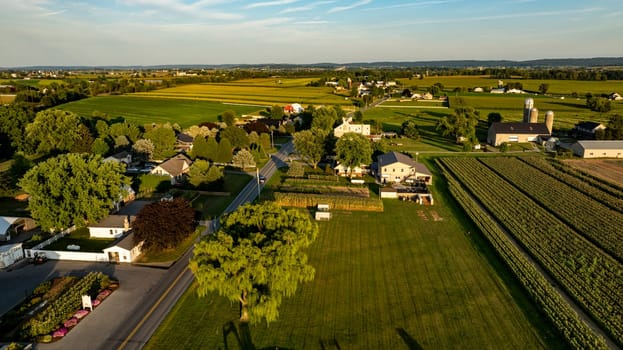 An Aerial View of Rural Farmland and Buildings at Dusk