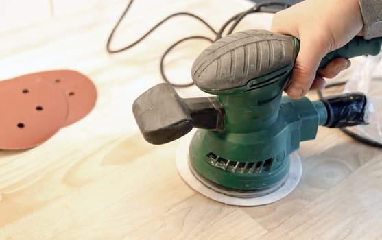 Work with a grinder on wood. Work tool. High quality photo