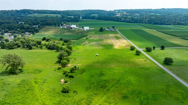 An Aerial View of Rural Farmlands and Countryside Road